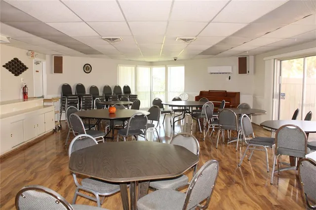 a kitchen with a refrigerator and cabinets