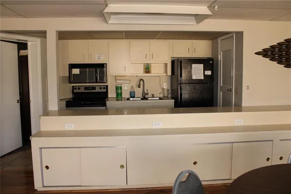 a view of a dining room with furniture and a window