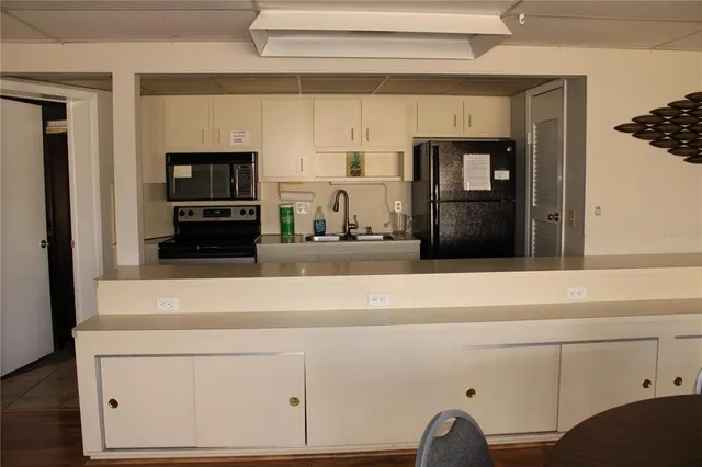a view of a dining room with furniture and a window