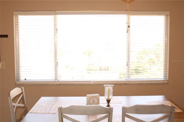 a bedroom with a bed and a lamp