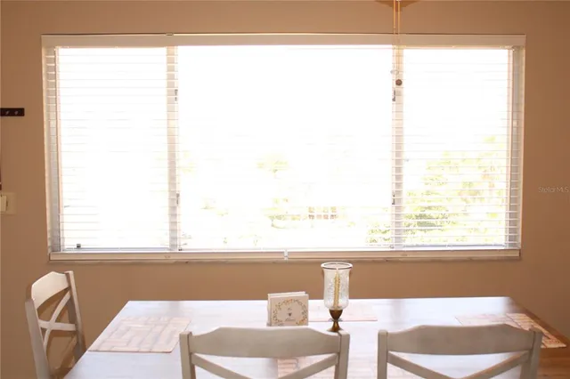 a bedroom with a bed and a lamp