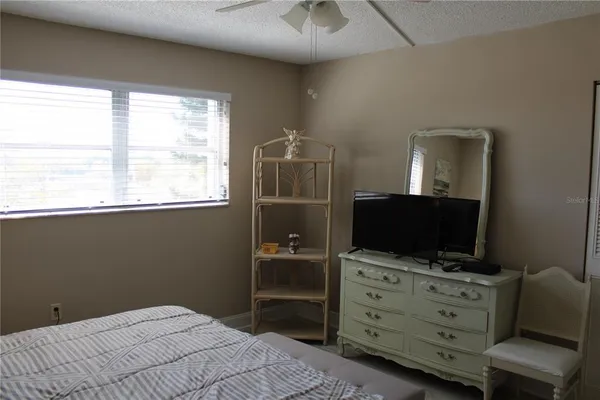 a room with furniture and flat screen tv