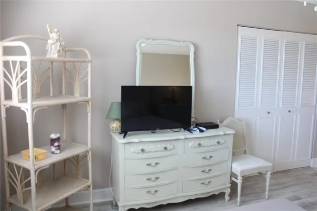 a bedroom with a bed and a chair