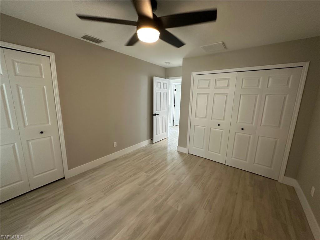 9165 Seville Road Fort Myers, FL 33967 - Photo 13 of 19 wooden floor in an empty room
