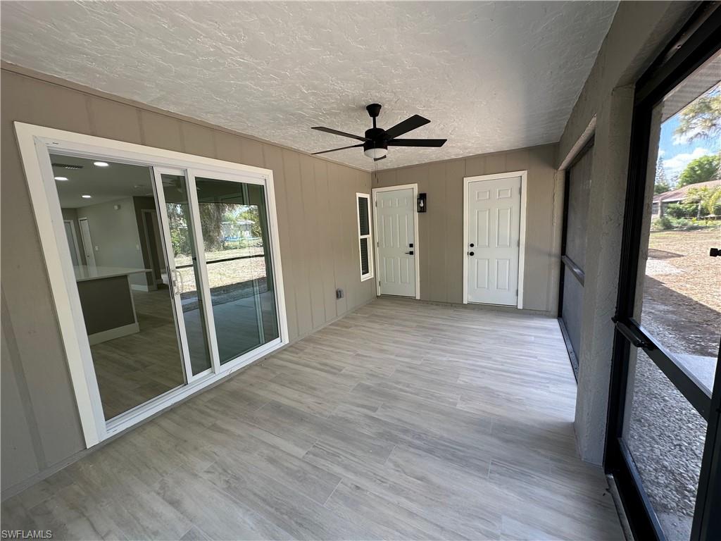 9165 Seville Road Fort Myers, FL 33967 - Photo 17 of 19 wooden floor in an empty room with a window