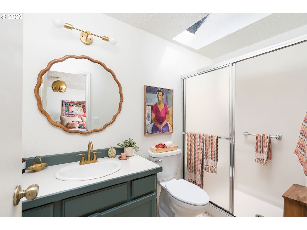 2910 Southwest Miles Street Portland, OR 97219 - Photo 20 of 39 a bathroom with a sink mirror and toilet