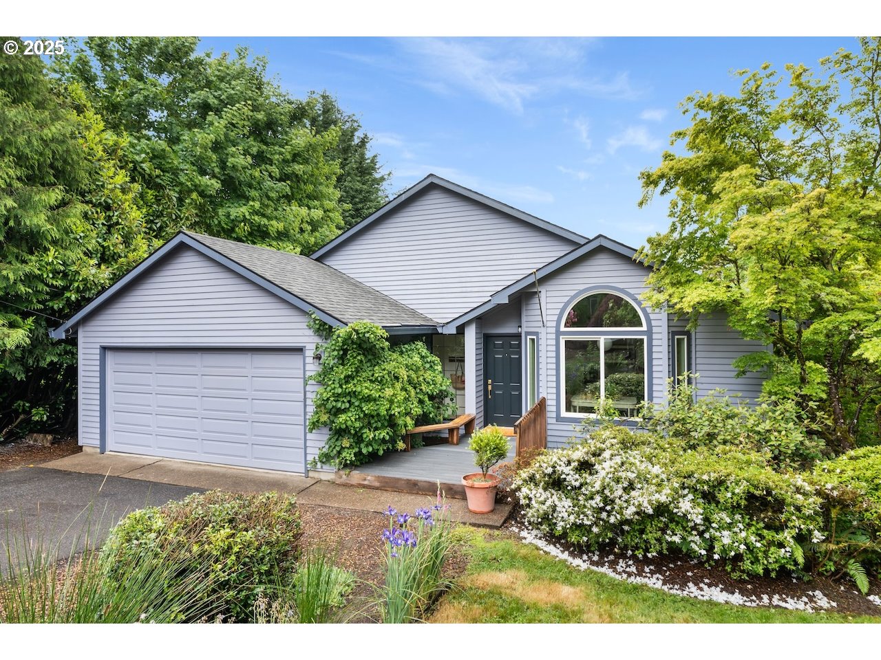 2910 Southwest Miles Street Portland, OR 97219 - Photo 28 of 39 a view of a house with a yard and potted plants
