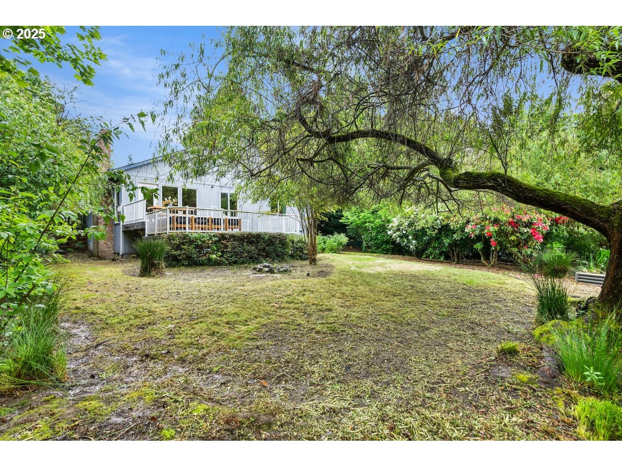 2910 Southwest Miles Street Portland, OR 97219 - Photo 34 of 39 a view of a house with a yard