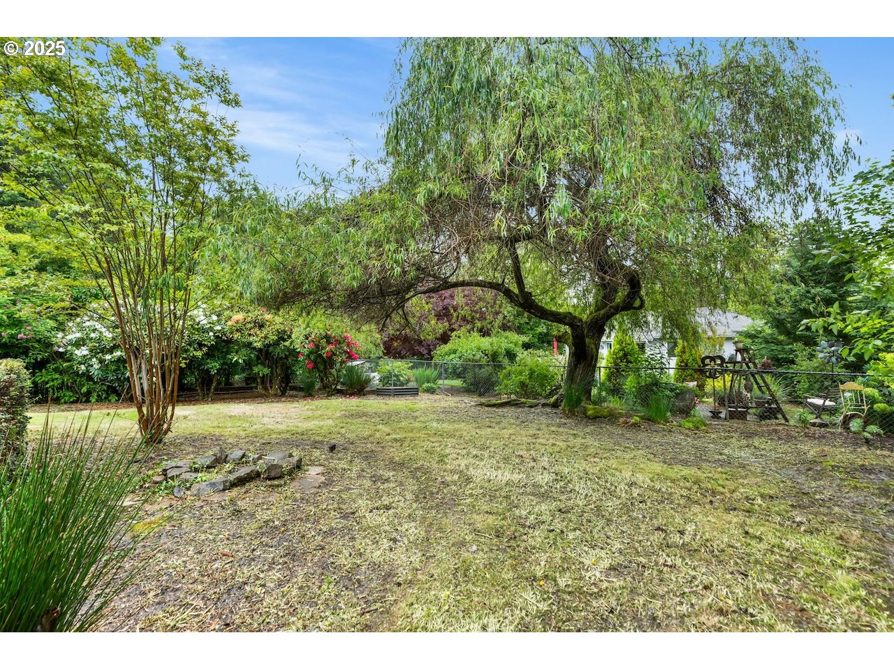 2910 Southwest Miles Street Portland, OR 97219 - Photo 35 of 39 a view of a yard with a tree