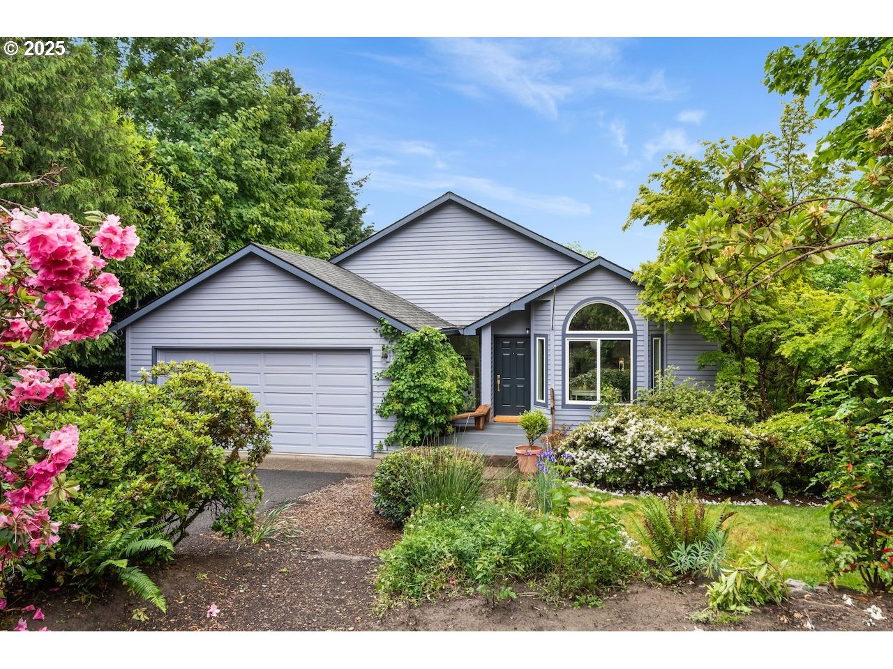2910 Southwest Miles Street Portland, OR 97219 - Photo 36 of 39 a front view of a house with a yard