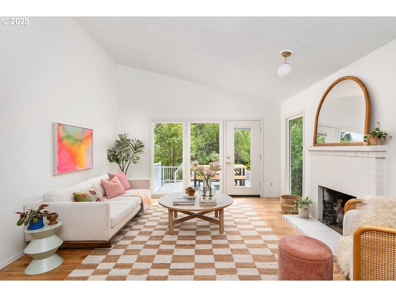 2910 Southwest Miles Street Portland, OR 97219 - Photo 5 of 39 a living room with furniture a fireplace and a floor to ceiling window