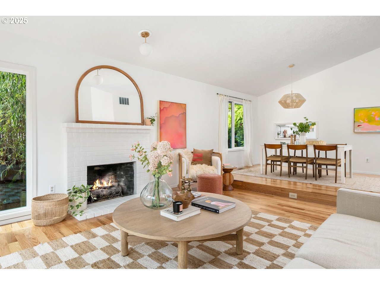 2910 Southwest Miles Street Portland, OR 97219 - Photo 7 of 39 a living room with furniture a fireplace and a potted plant
