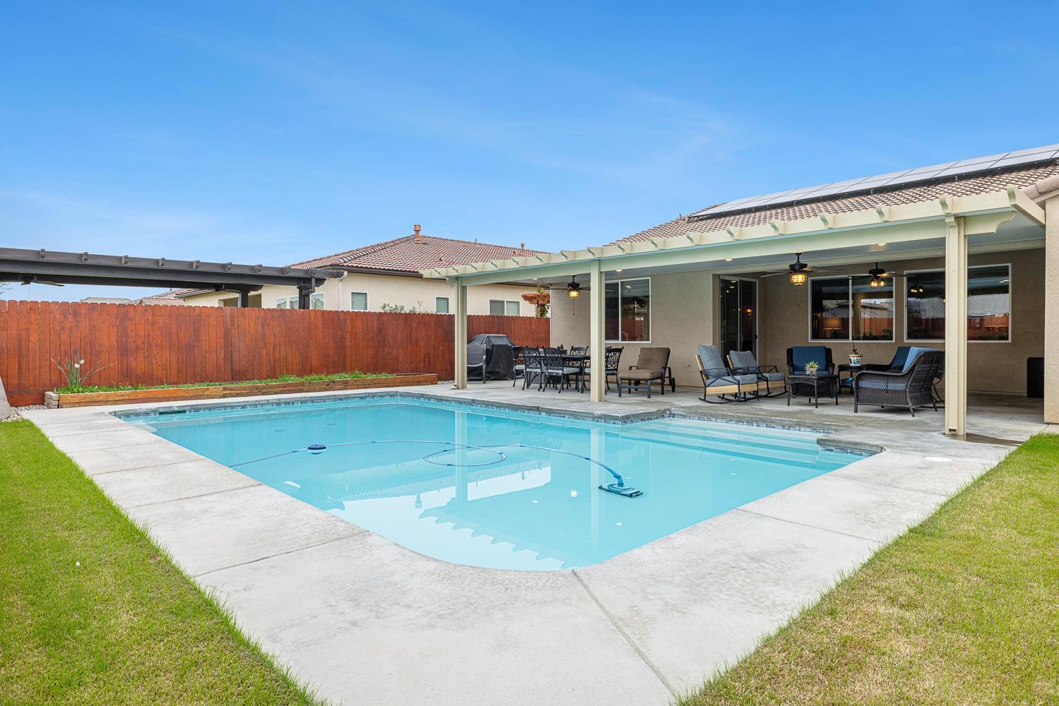 3293 Soledad Avenue Clovis, CA 93619 - Photo 34 of 37 a view of a patio with swimming pool table and chairs