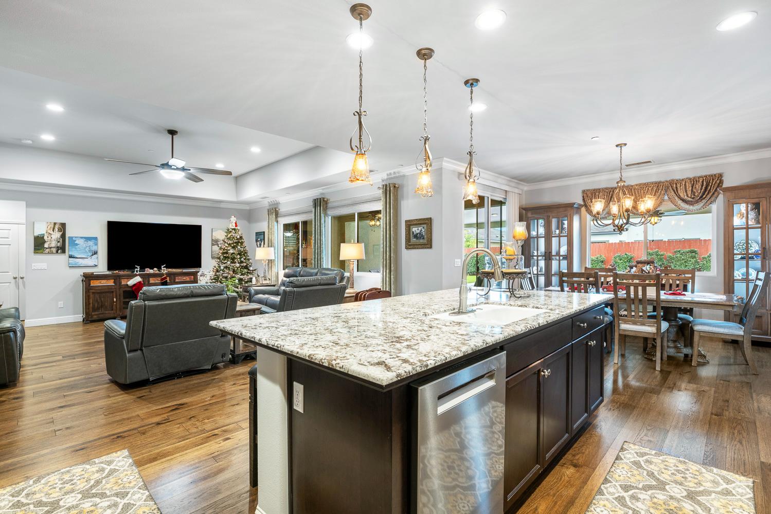 3293 Soledad Avenue Clovis, CA 93619 - Photo 10 of 37 a kitchen with a counter top space a sink appliances and a living room