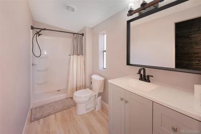 a white toilet sitting next to a bath tub shower