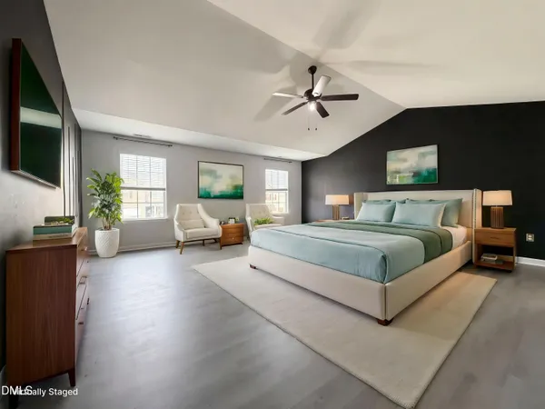 a bedroom with a large bed a flat tv screen and a bookshelf