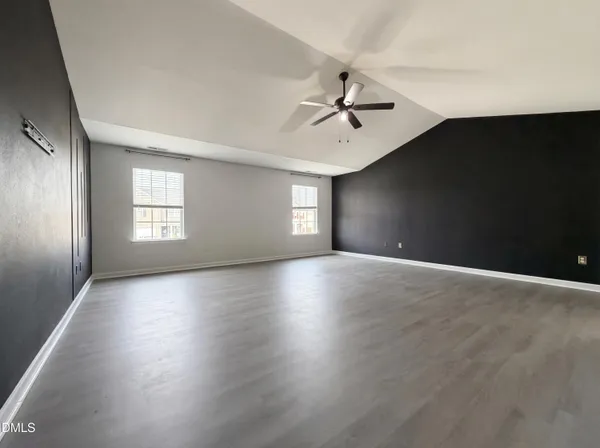 a view of empty room with windows