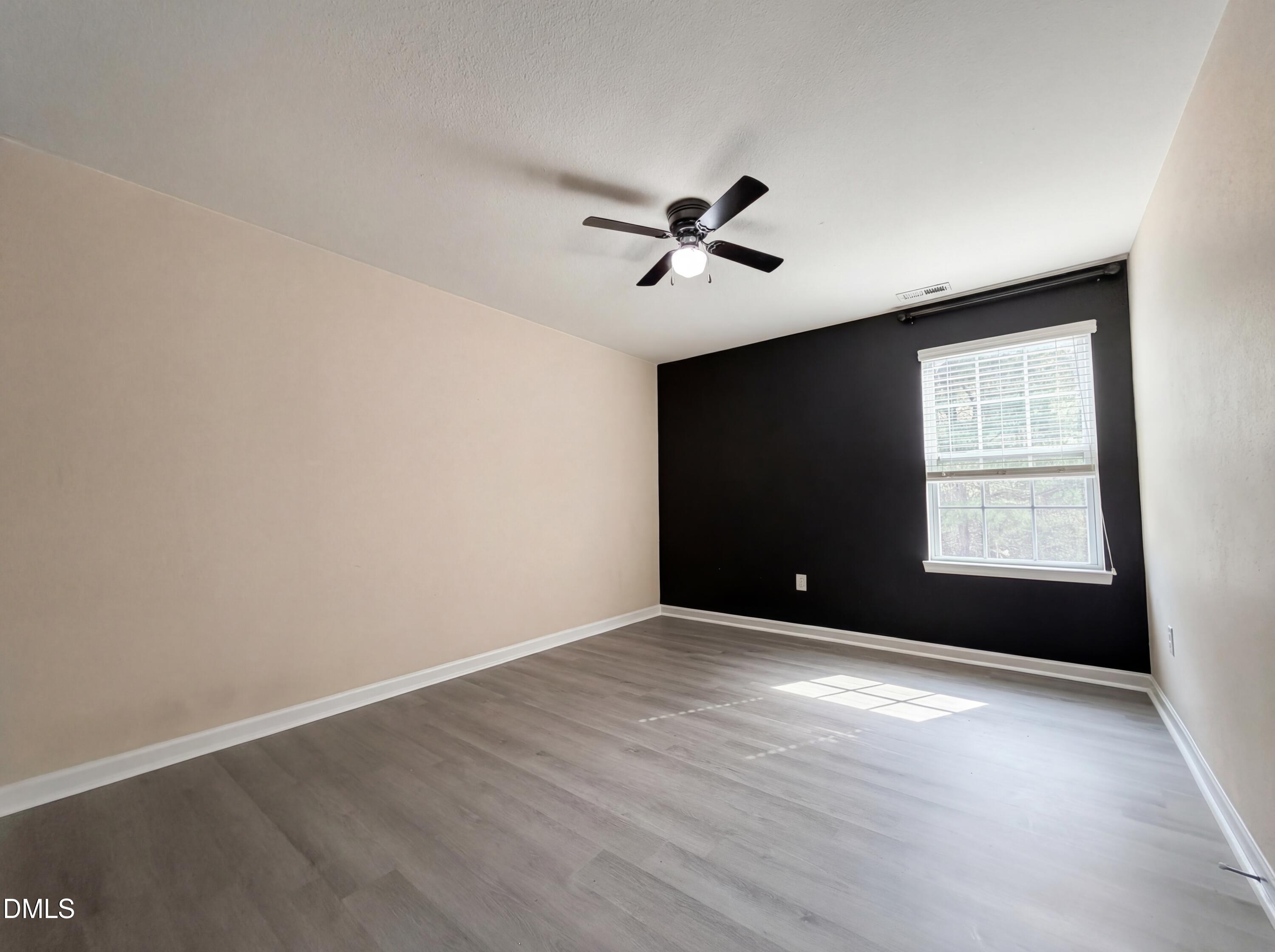 574 Botanical Court Bunnlevel, NC 28323 - Photo 14 of 20 a view of an empty room with a window