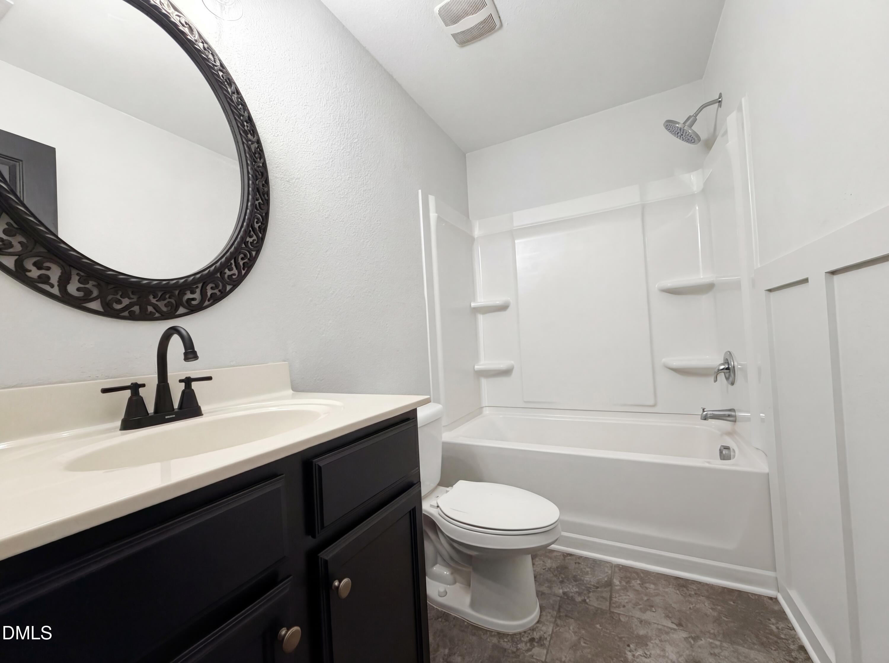 574 Botanical Court Bunnlevel, NC 28323 - Photo 18 of 20 a bathroom with a sink a toilet and a mirror