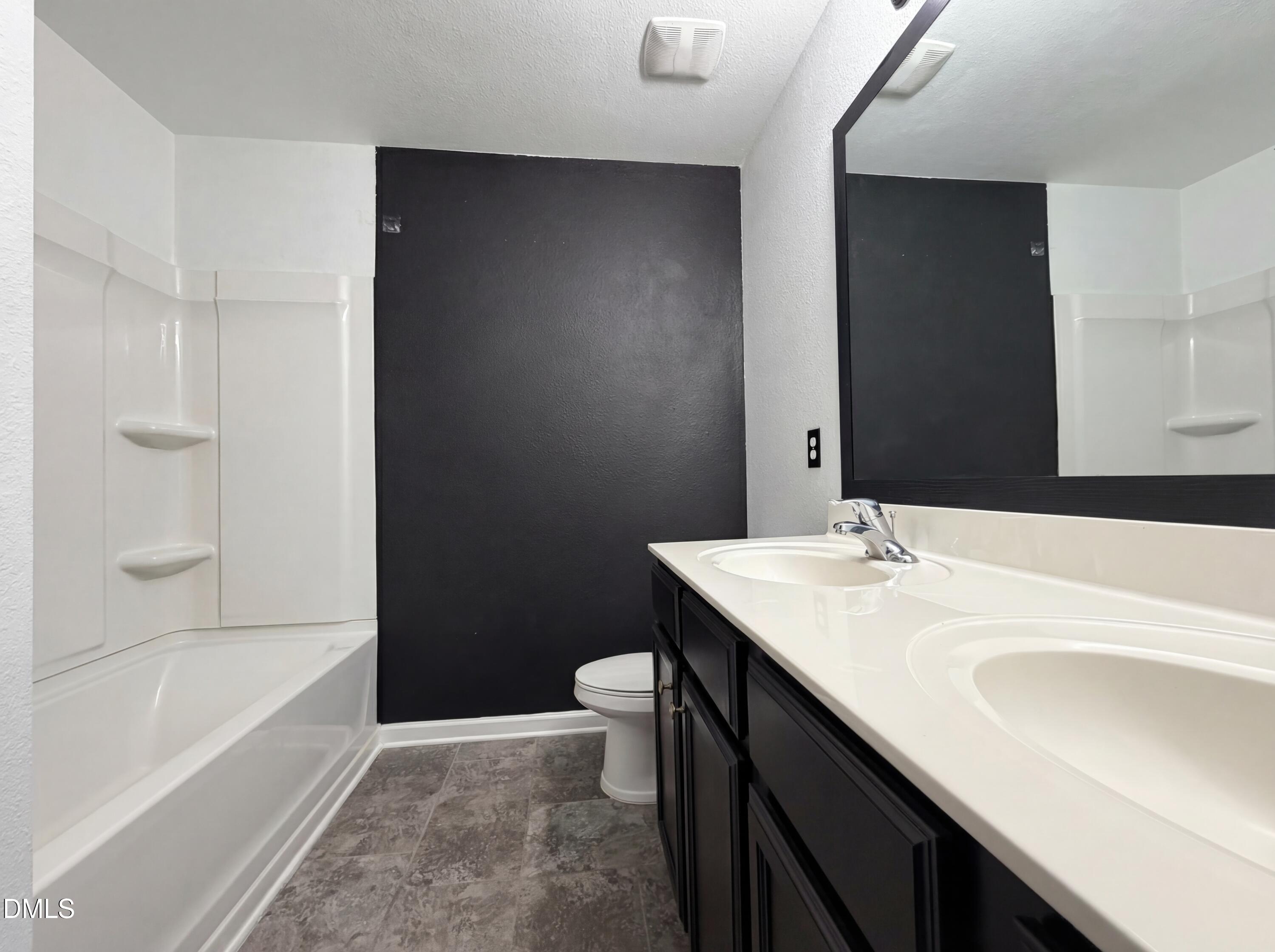 574 Botanical Court Bunnlevel, NC 28323 - Photo 19 of 20 a bathroom with a sink a mirror and a bathtub