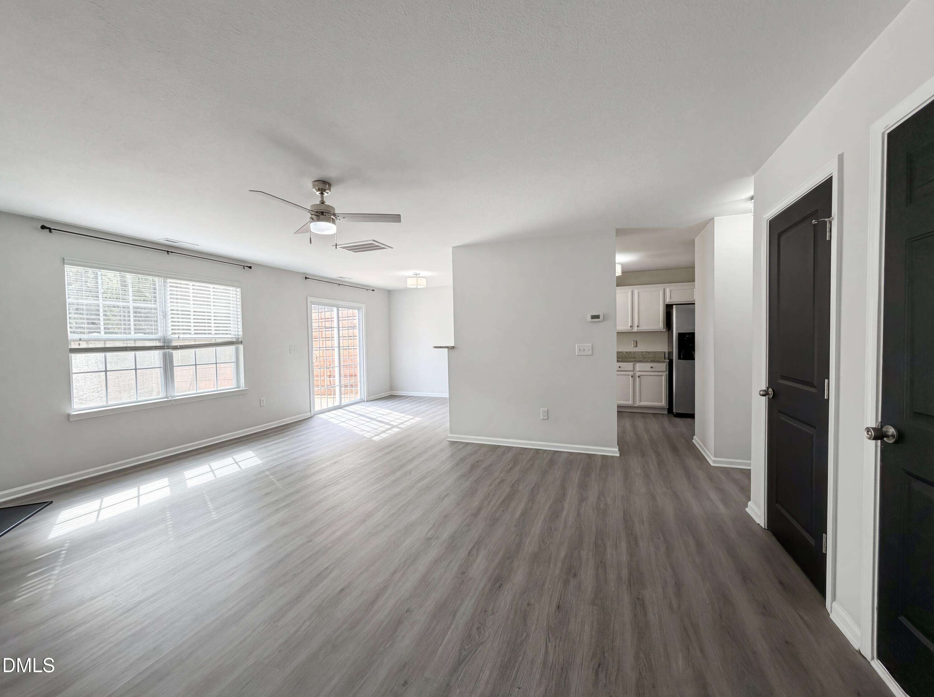 574 Botanical Court Bunnlevel, NC 28323 - Photo 4 of 20 wooden floor in an empty room with a window