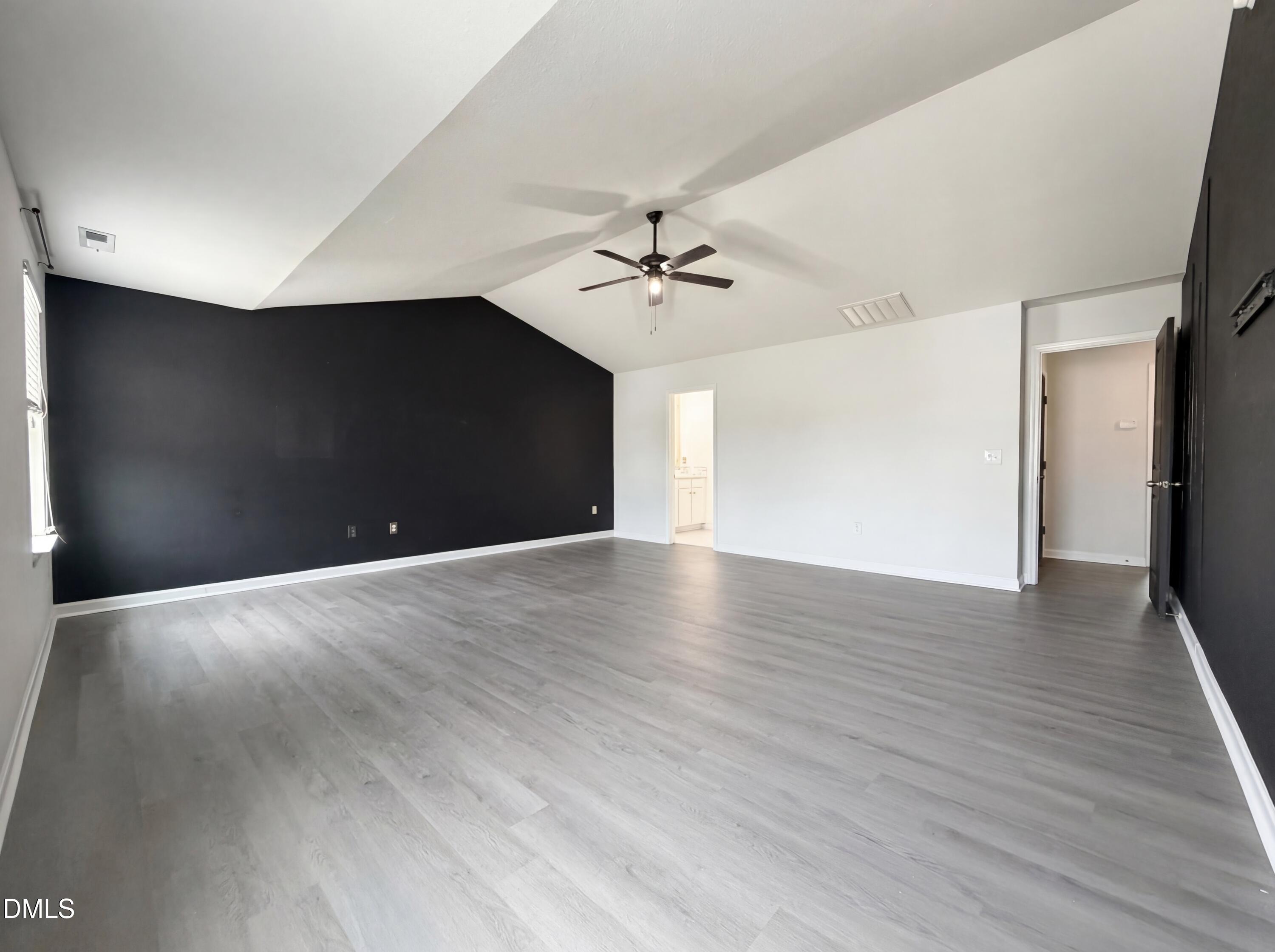 574 Botanical Court Bunnlevel, NC 28323 - Photo 10 of 20 a view of a livingroom with a ceiling fan wooden floor and a ceiling fan