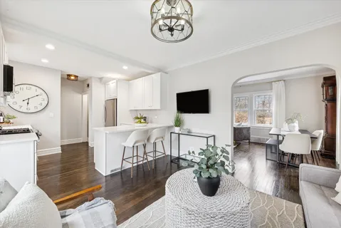 a living room with fireplace furniture and a flat screen tv