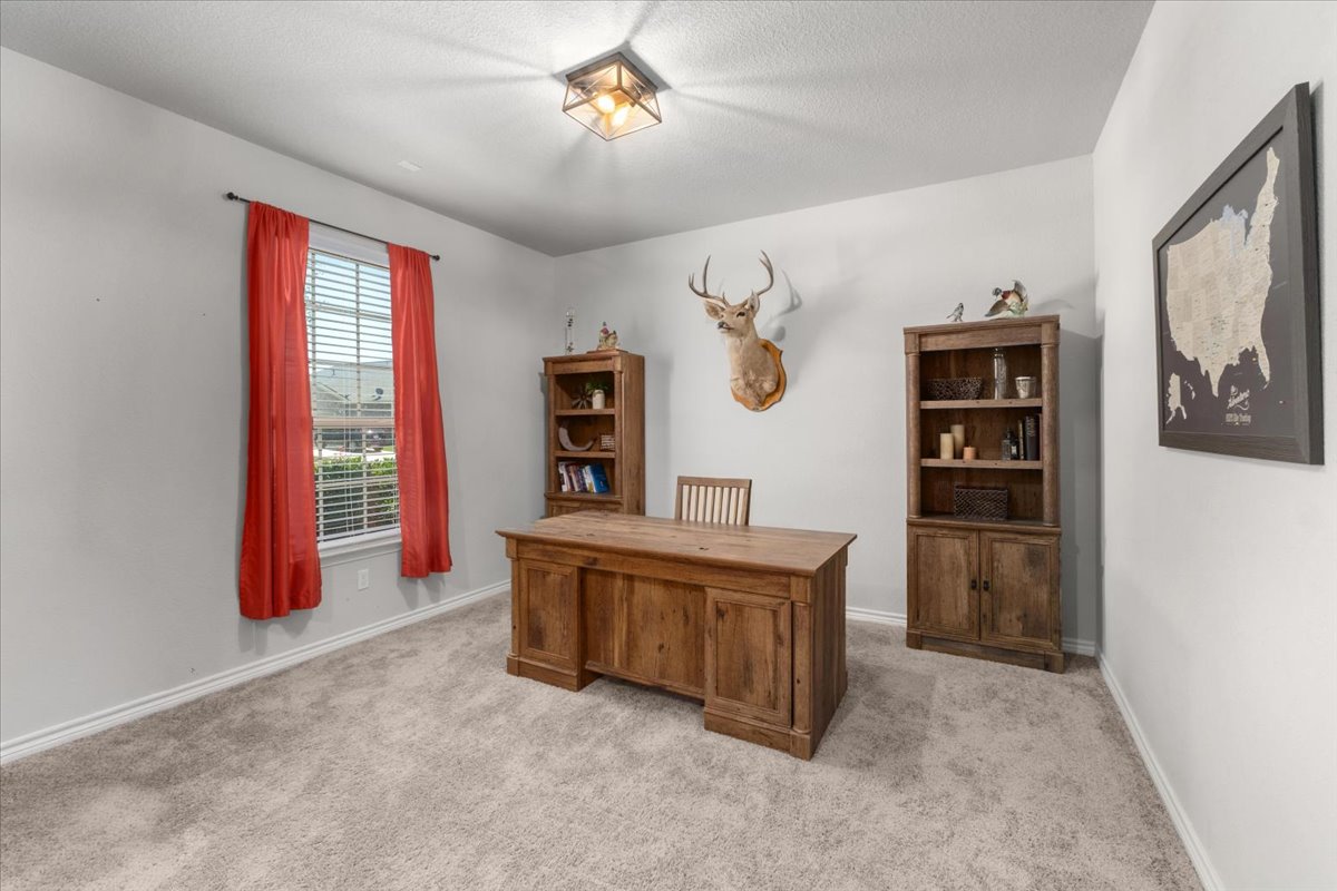 5408 Vanner Path Georgetown, TX 78626 - Photo 6 of 34 Recessed lighting fixture, light gray wall paint, and gray carpet flooring