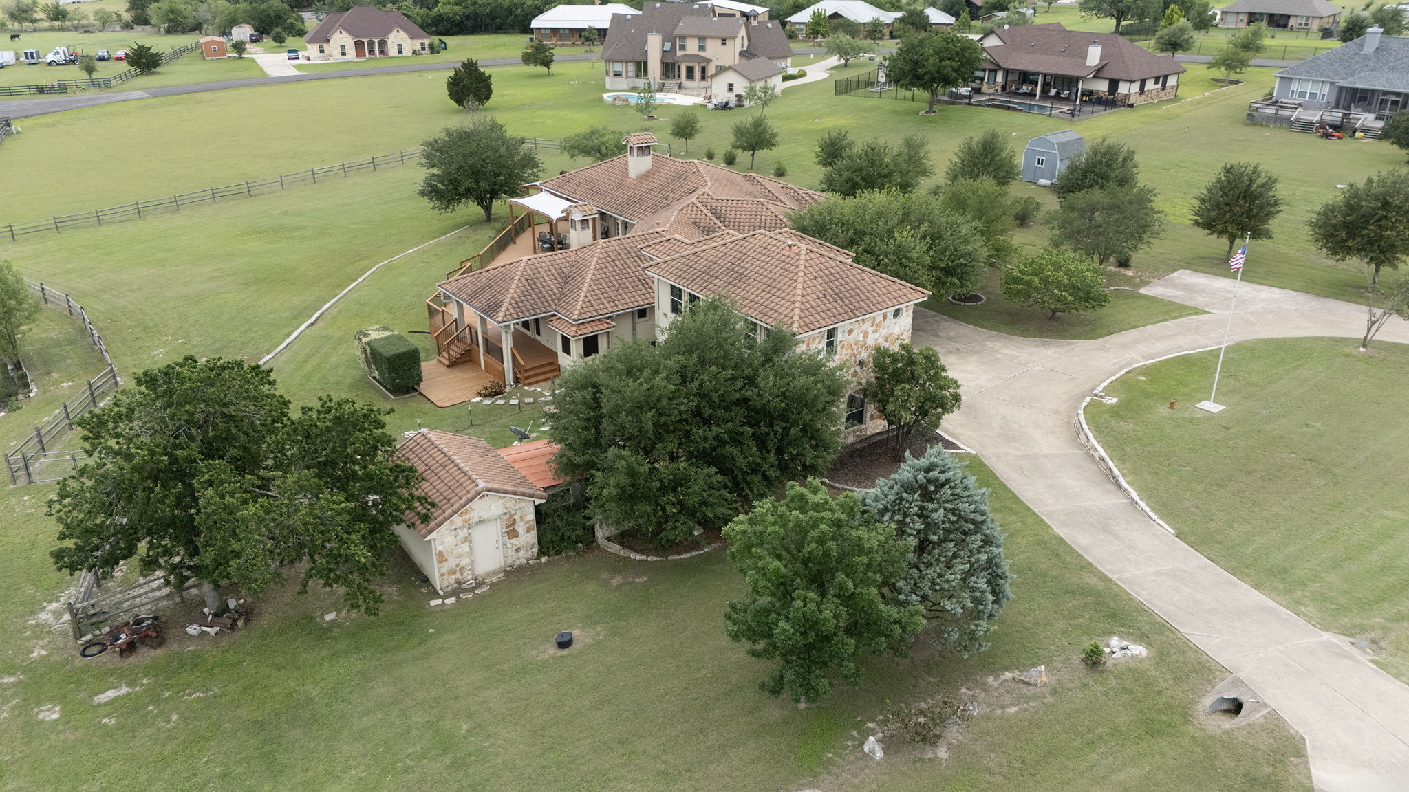 17308 St Therese Road Manor, TX 78653 - Photo 38 of 40 an aerial view of a house with a yard and lake view