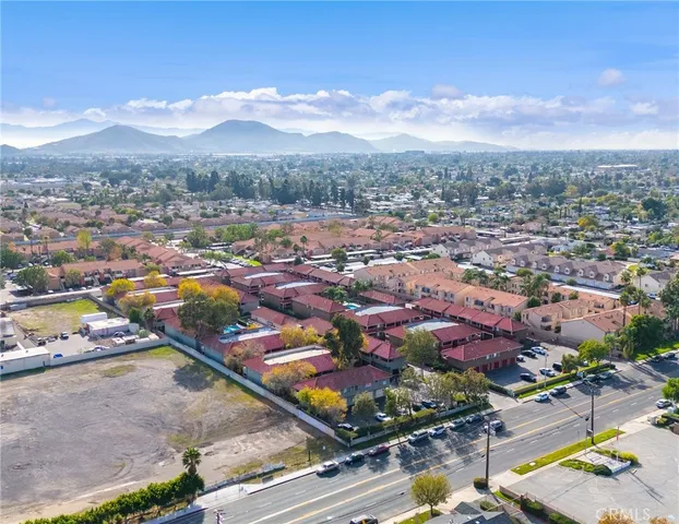 an aerial view of residential houses with outdoor space