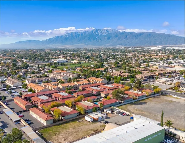 an aerial view of residential houses and outdoor space