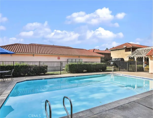 a view of a swimming pool with a patio