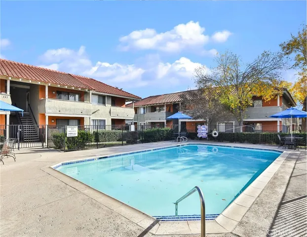 a view of a house with swimming pool