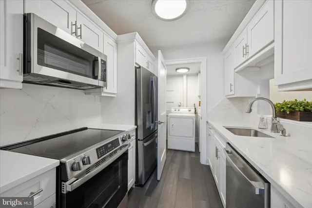 a kitchen with a stove and a microwave