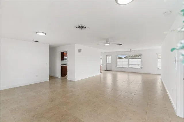 an empty room with a empty space and window