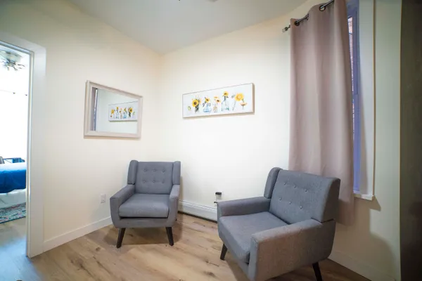 a living room with furniture and a chair