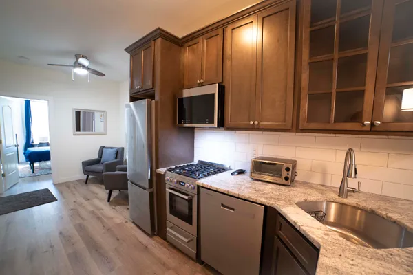 a kitchen that has a sink and a stove