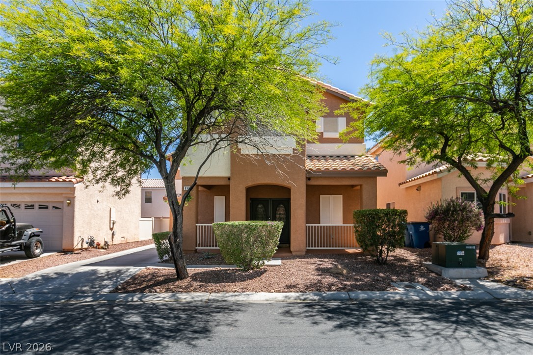 8909 Houston Ridge Avenue Las Vegas, NV 89178 - Photo 1 of 45 Two-story home with terracotta tile roof and mature trees for ample shade.