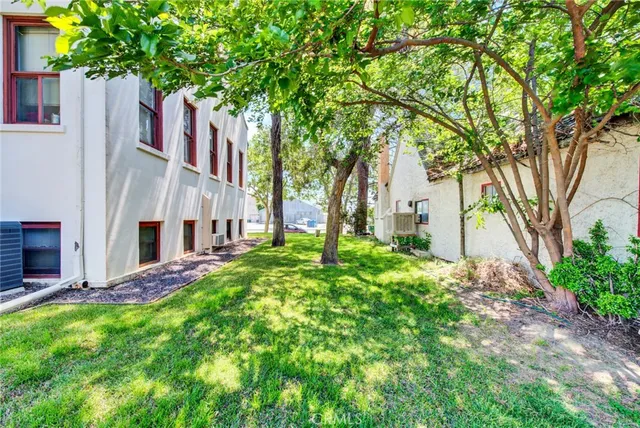 a car parked in front of a house with a street