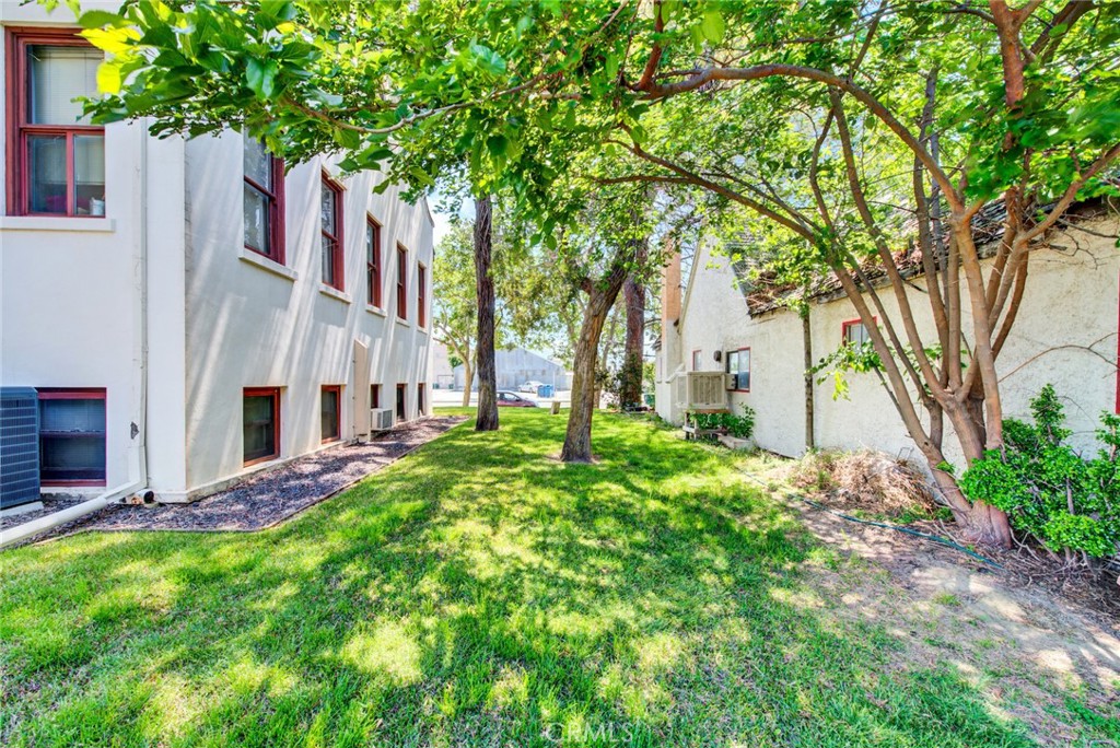 618 4th Street Corning, CA 96021 - Photo 11 of 36 a view of a house with a tree in front of it