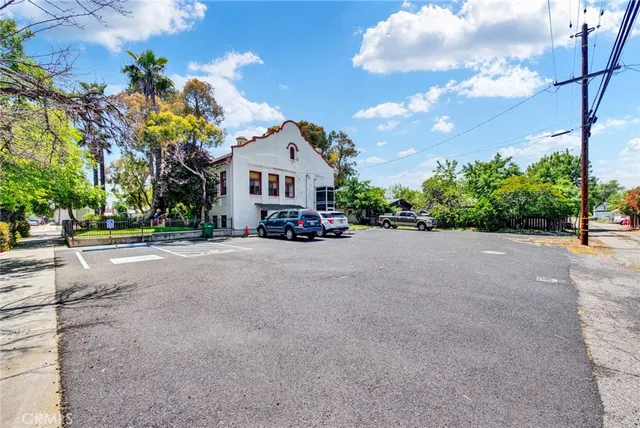 a view of a park with a large trees