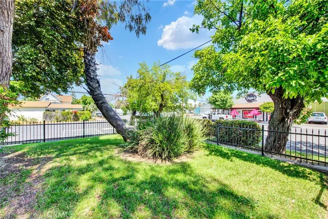 a view of a chair and table in the garden