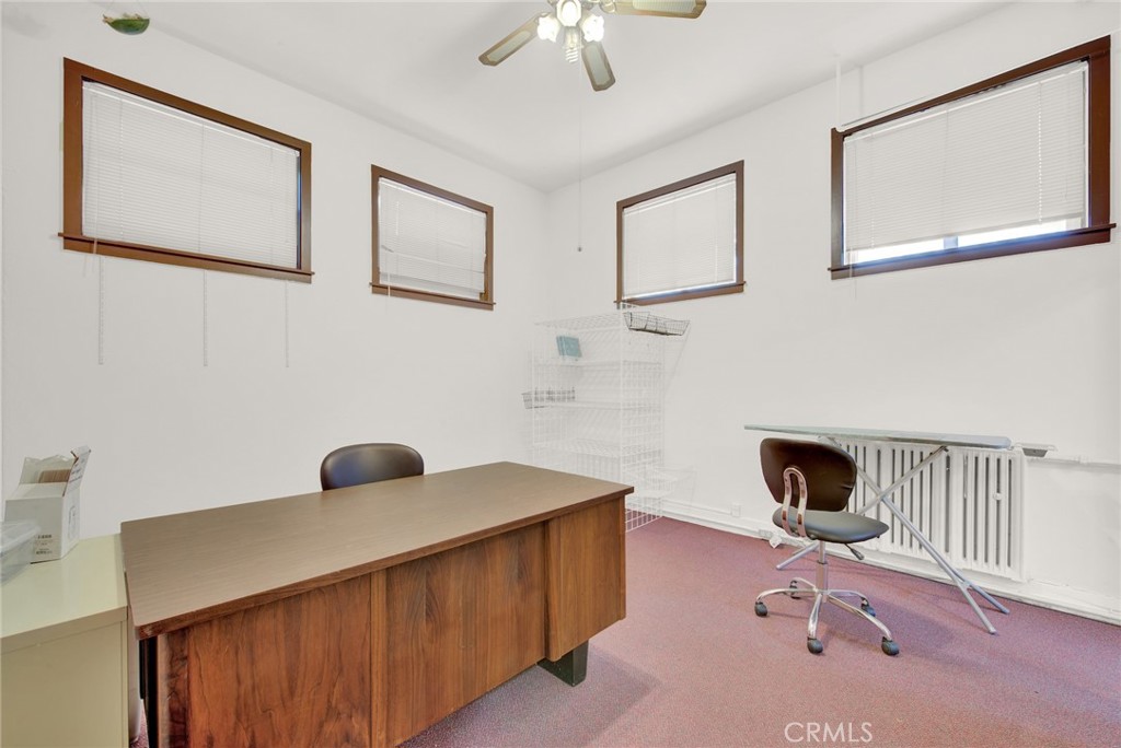 618 4th Street Corning, CA 96021 - Photo 21 of 36 a bedroom with a bed and a chandelier