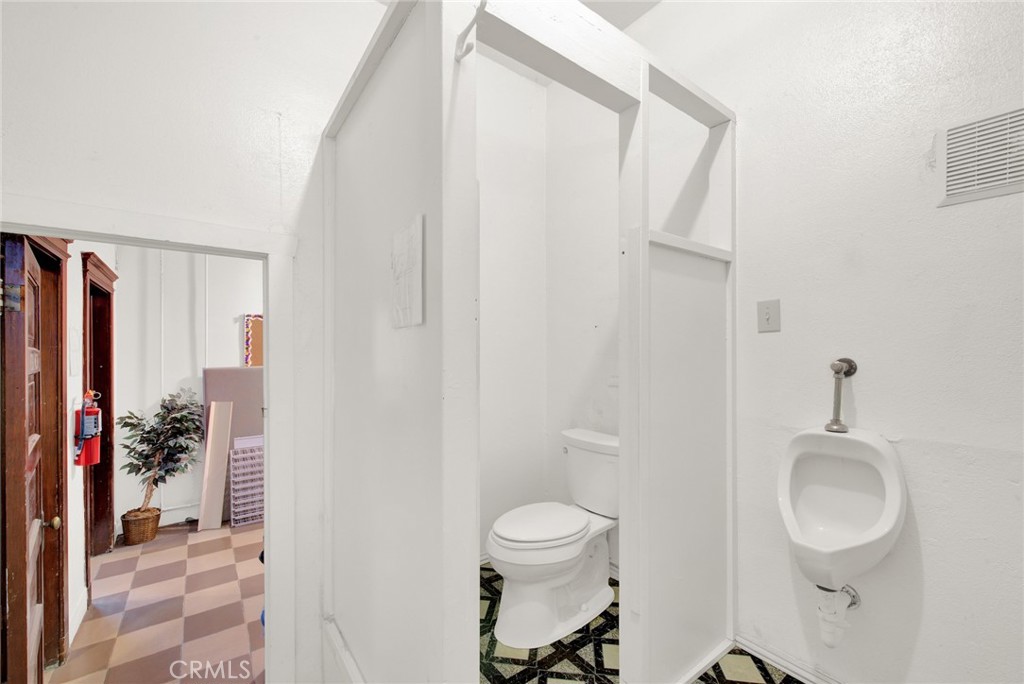 618 4th Street Corning, CA 96021 - Photo 28 of 36 a bathroom with a toilet a sink and shower curtain