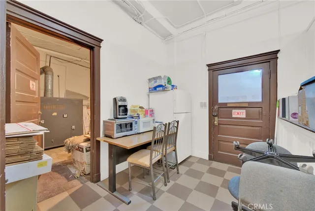 a view of a livingroom with furniture and closet
