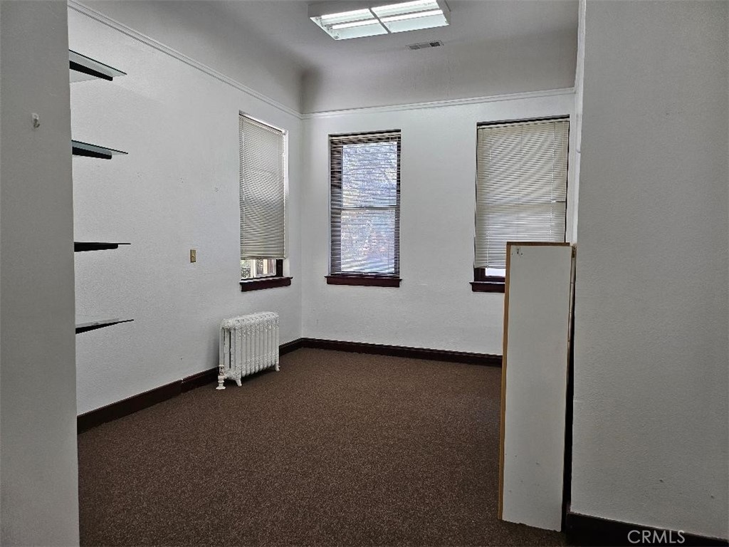 618 4th Street Corning, CA 96021 - Photo 34 of 36 a view of a room with two windows and a ceiling fan