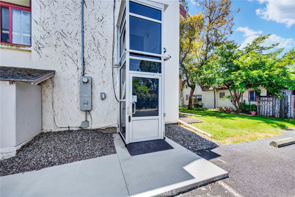 618 4th Street Corning, CA 96021 - Photo 5 of 36 a view of a house with a large window and yard