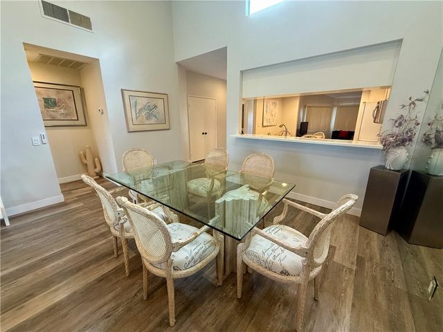 a bedroom with a bed and large window