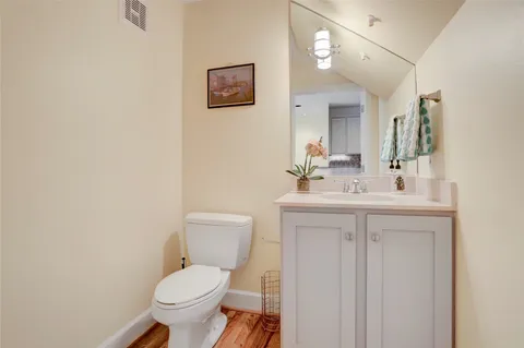 a workspace with wooden floor and a window