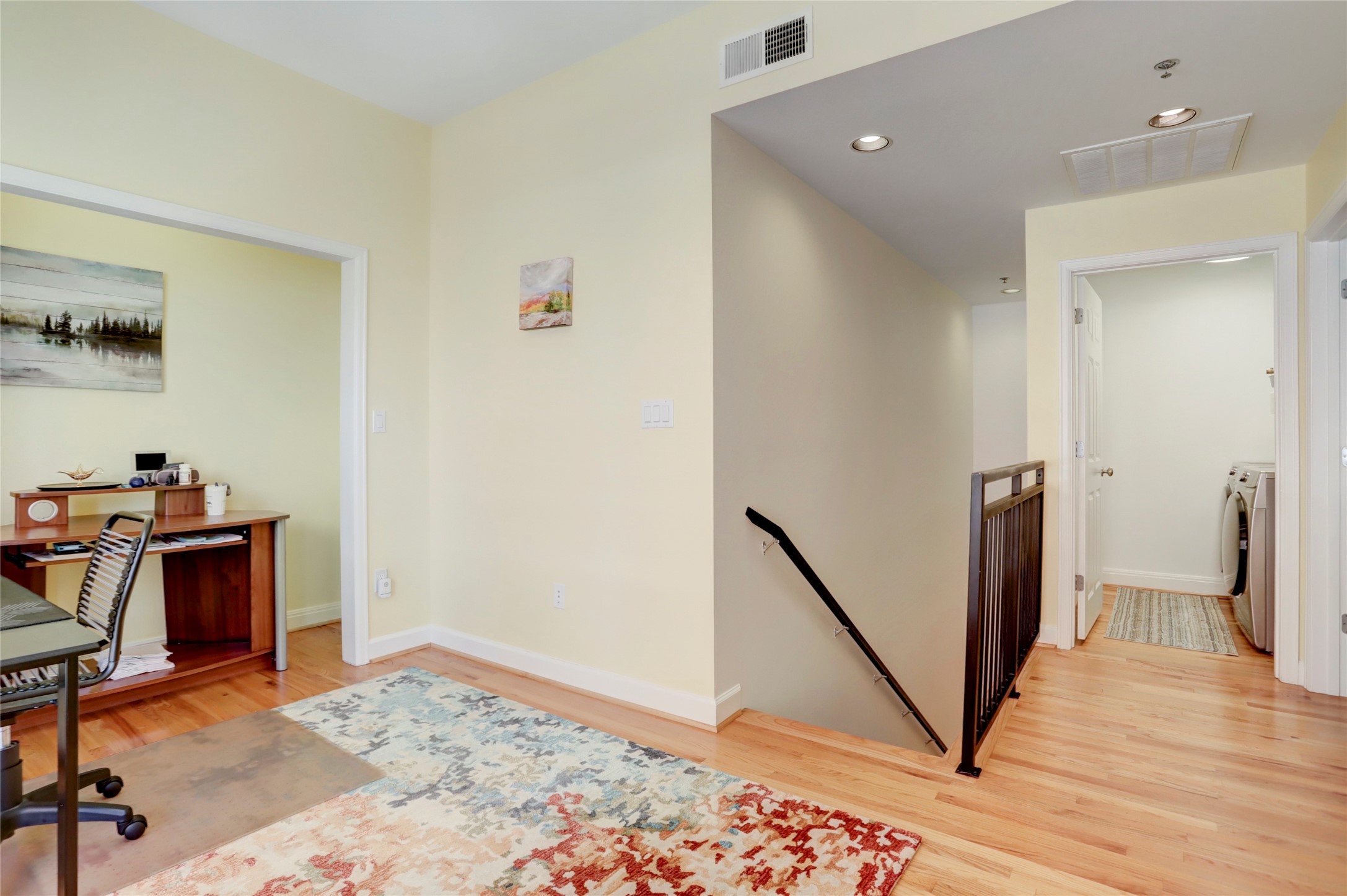 2520 Robinhood Street, Unit 1008 Houston, TX 77005 - Photo 15 of 27 a view of a hallway with workspace and wooden floor